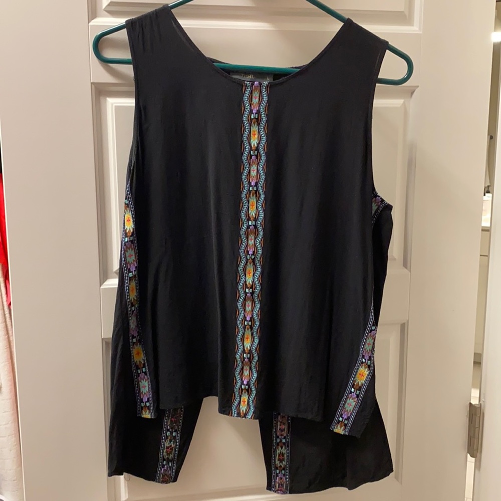 Black sleeveless top with embroidery.